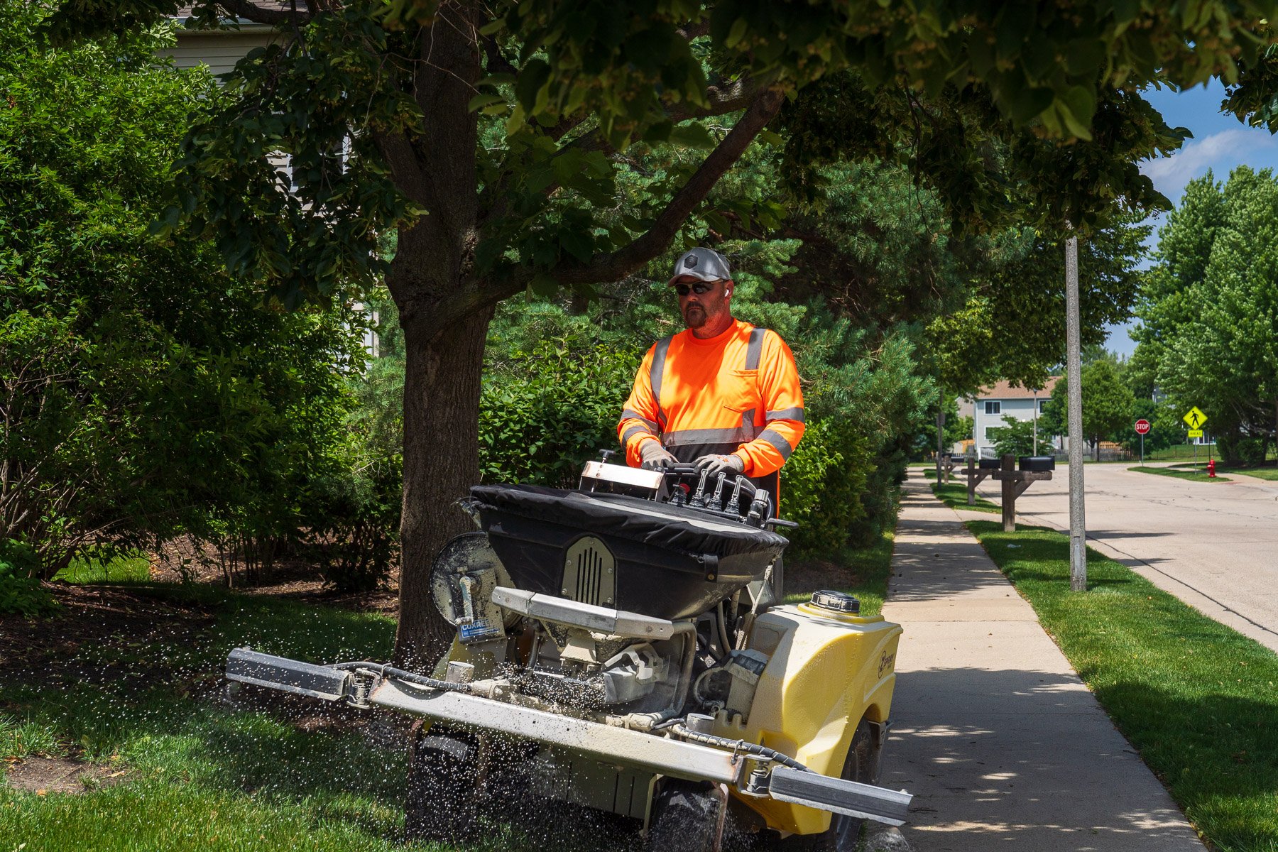 crew fertilizing lawn