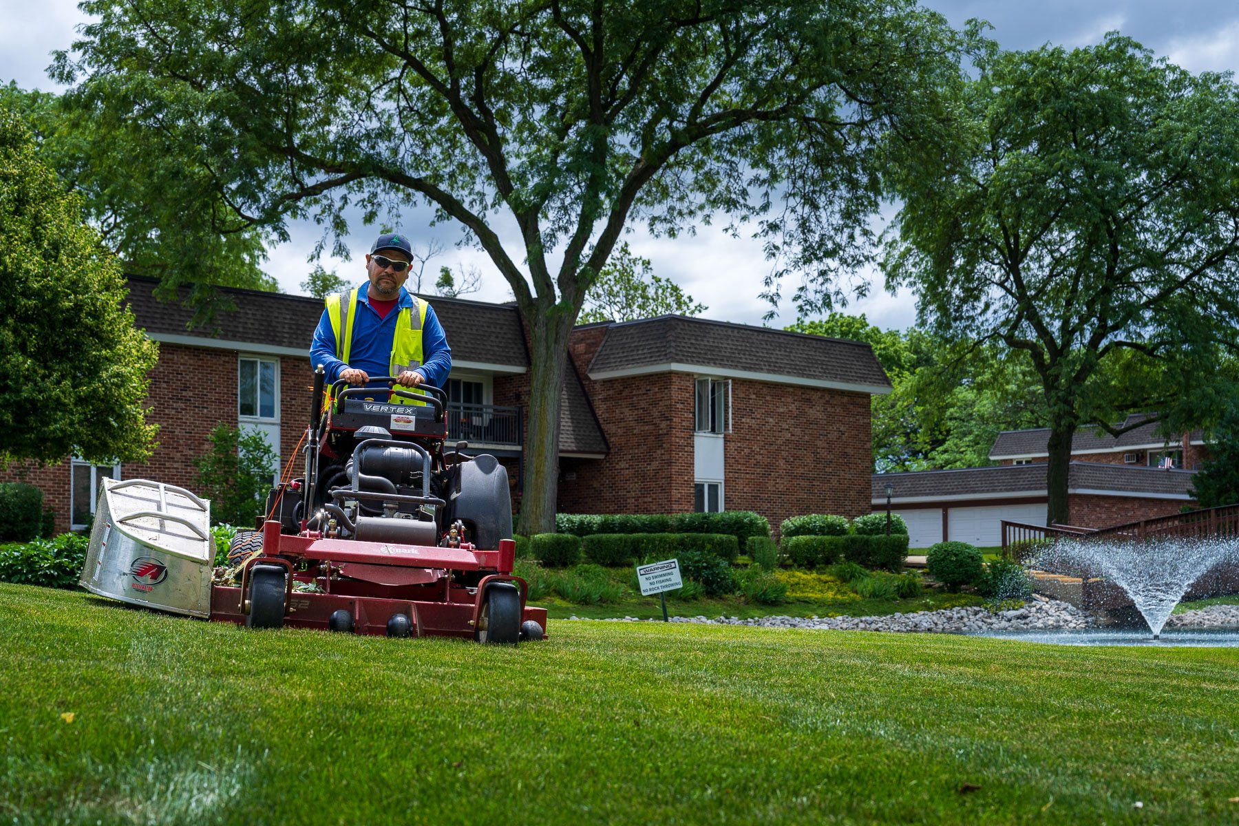 landscape maintenance crew mowing lawn 2