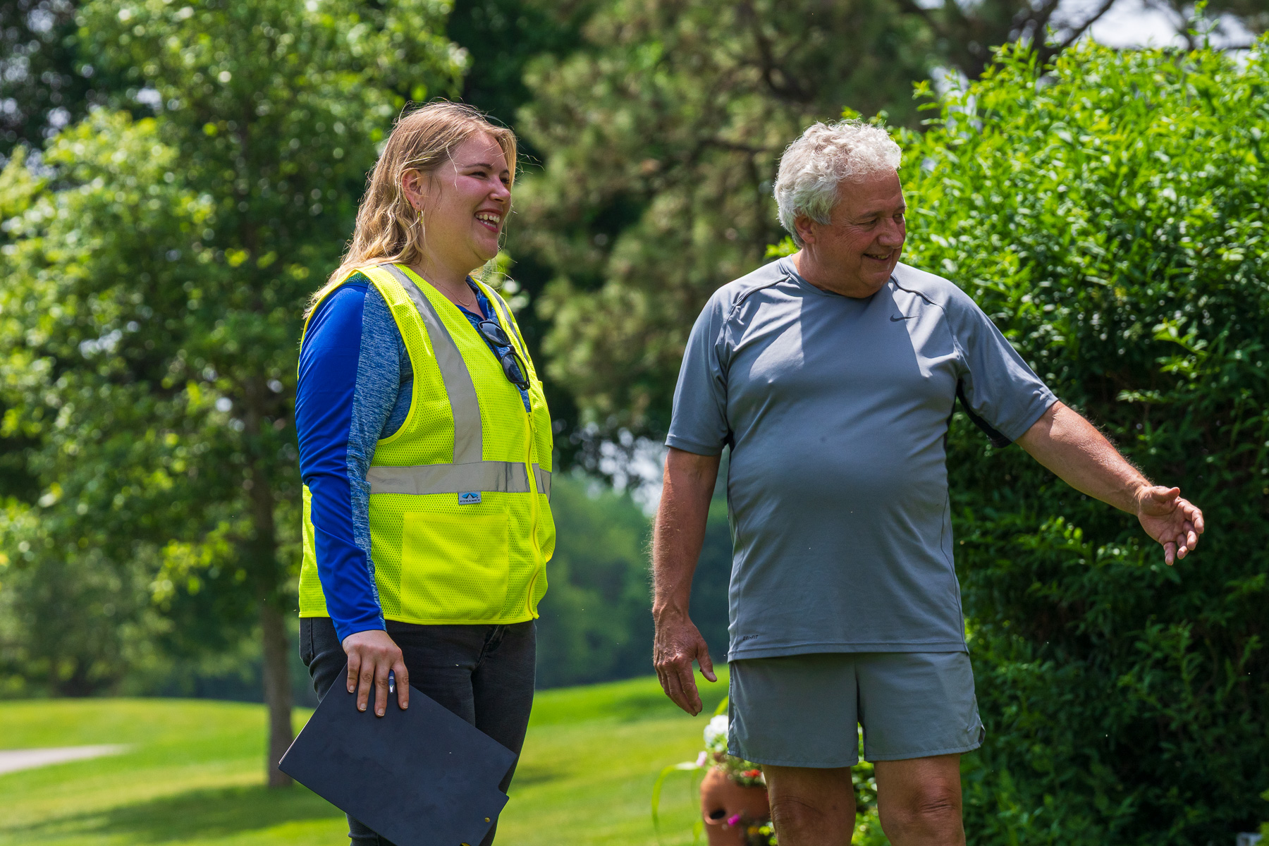 account manager talking to homeowner green lawn 2