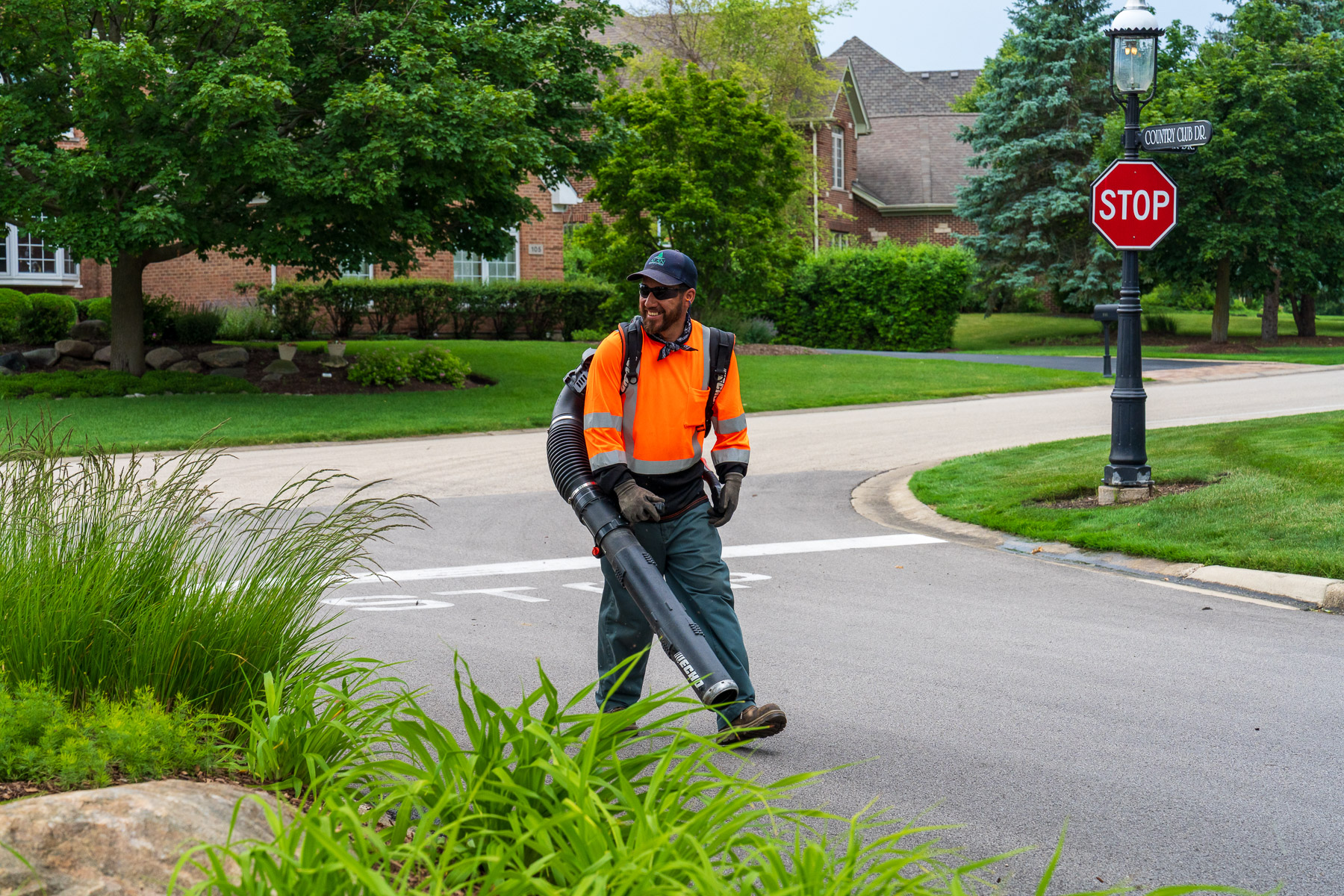 crew maintenance clean up blowing off street
